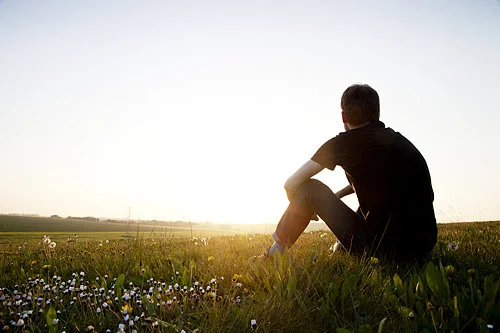 Man Sitting Hillside